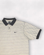 Patterned polo shirt with Nike logo on a light gray background
