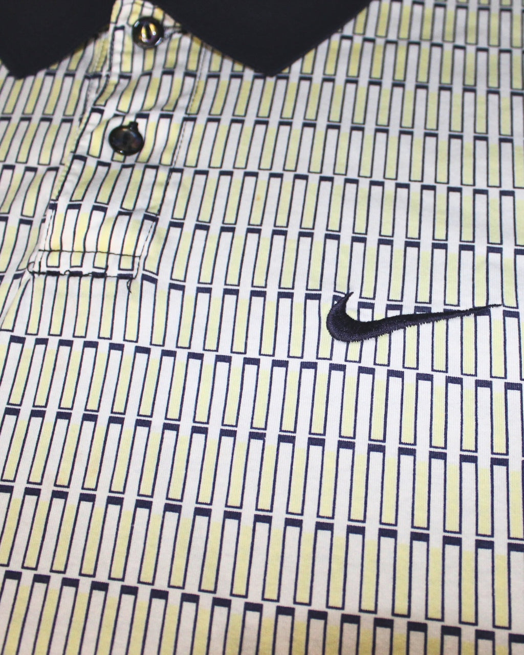Close-up of a patterned shirt with a Nike logo