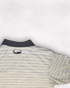 Close-up of a patterned shirt with a logo on a white background